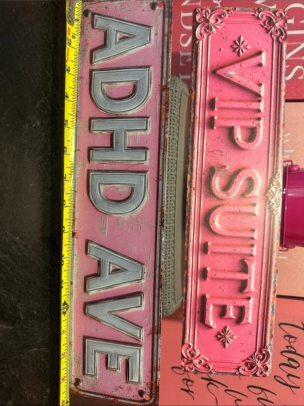 Pink Floral wall curtain with Pink Decorative Signs and metal plates.
